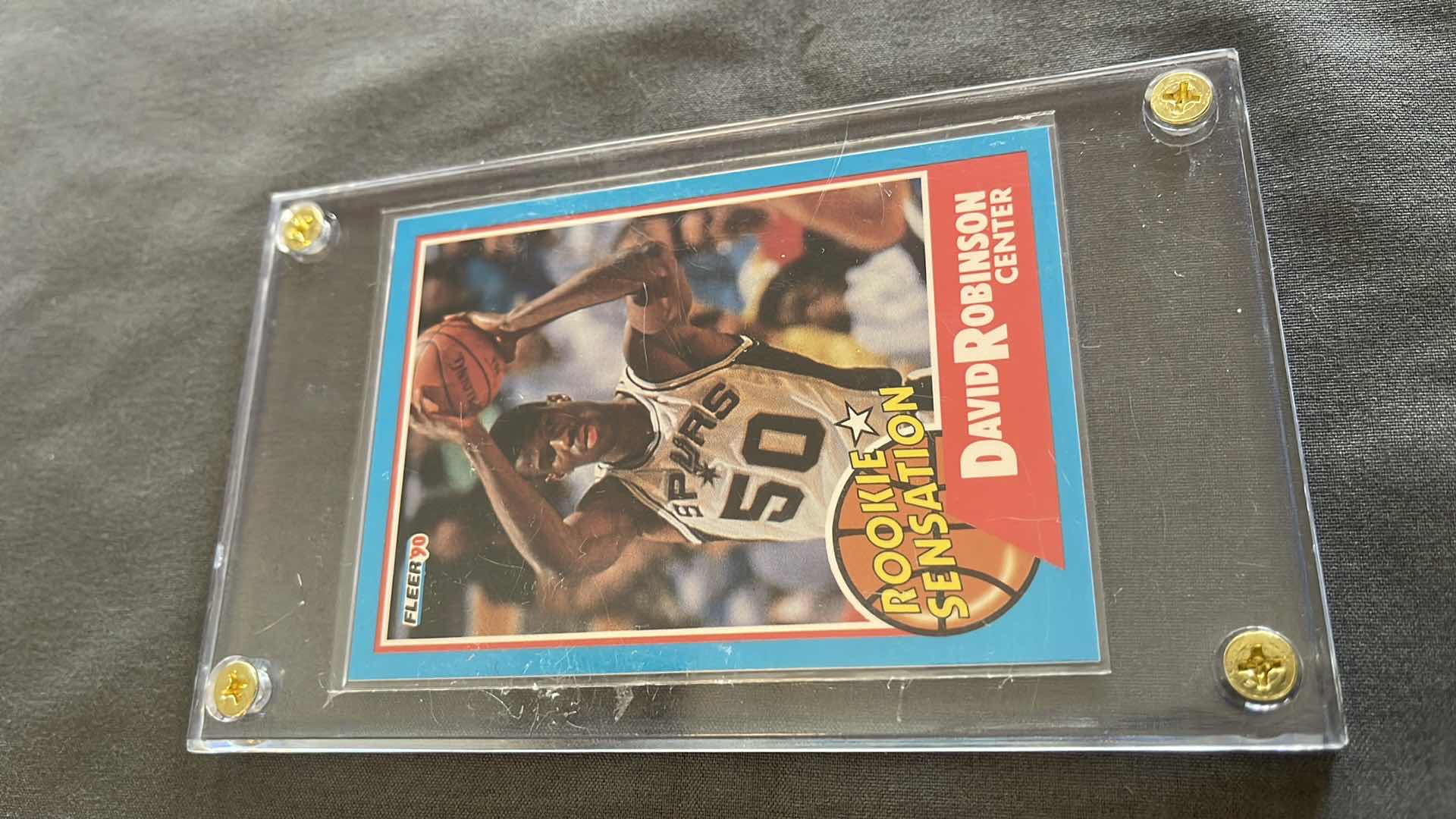 Photo 1 of 1990 DAVID ROBINSON FLEER ROOKIE SENSATION CARD 1