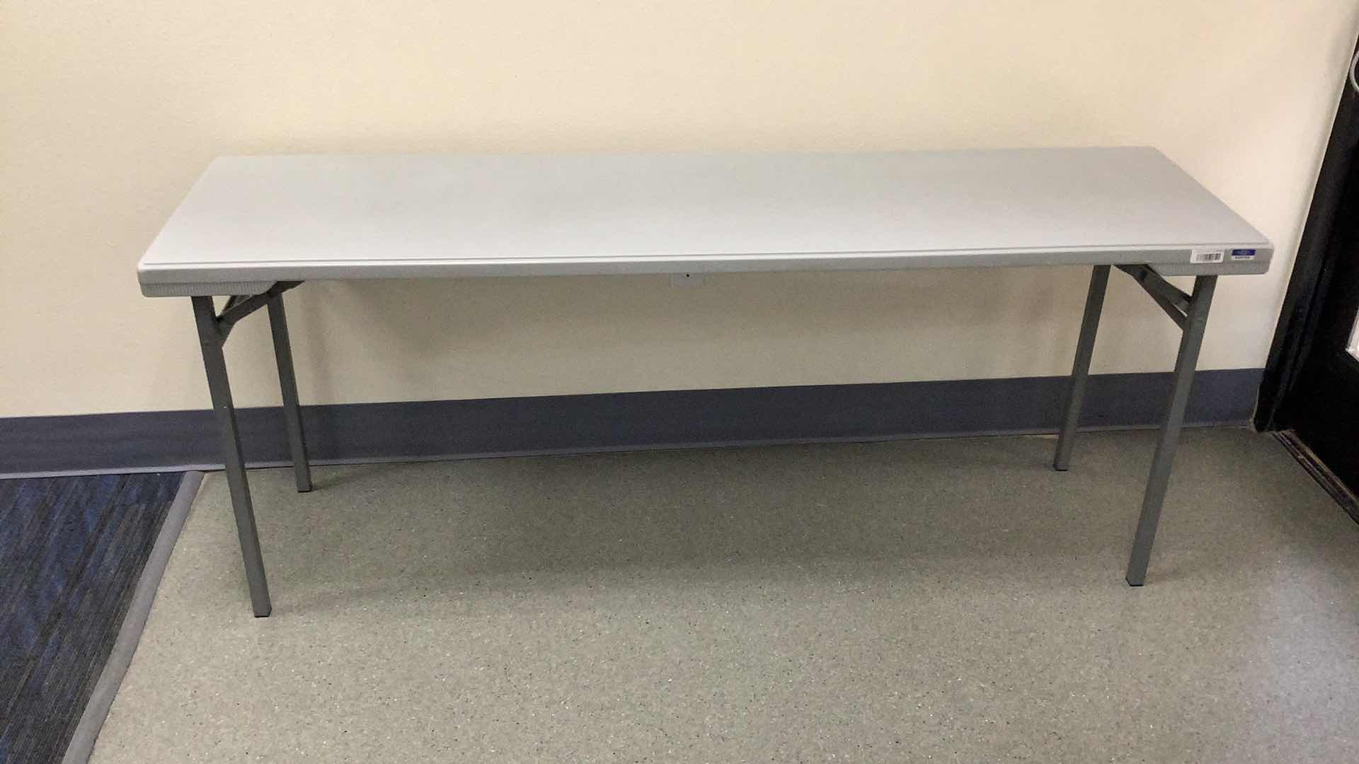 Photo 1 of MULTIPURPOSE FOLDING TABLE 71”X 20” H29” 