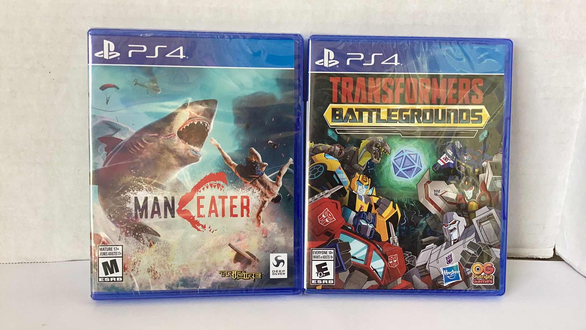 Photo 1 of 2 NEW PS4 GAMES: MAN EATER AND TRANSFORMERS BATTLEGROUNDS