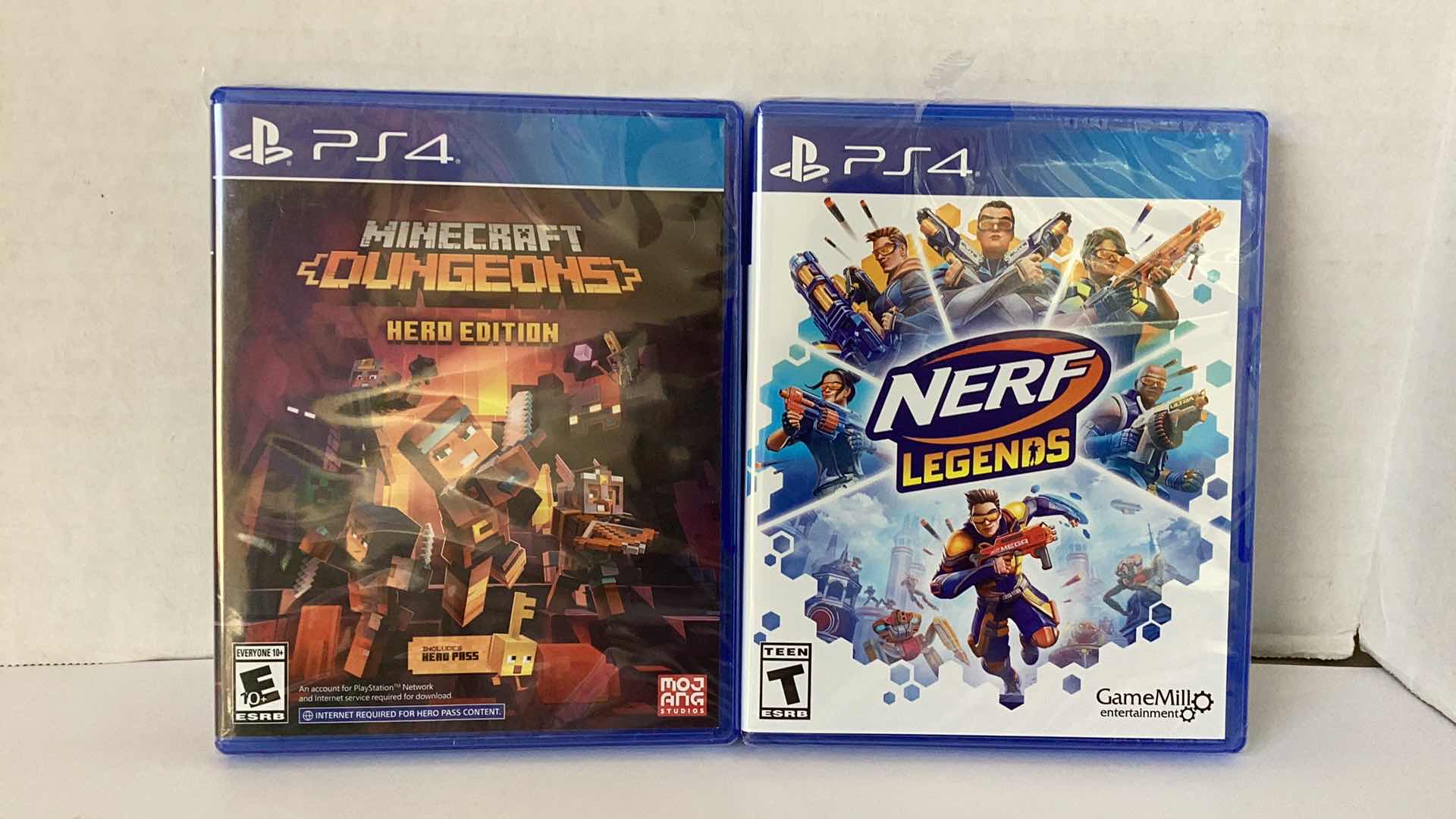 Photo 1 of 2 NEW PS4 GAMES: MINECRAFT DUNGEONS HERO EDITION AND NERF LEGENDS