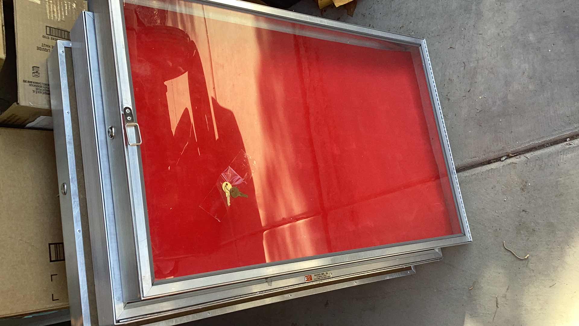 Photo 2 of ONE GLASS AND ALUMINUM DISPLAY CASE WITH KEYS