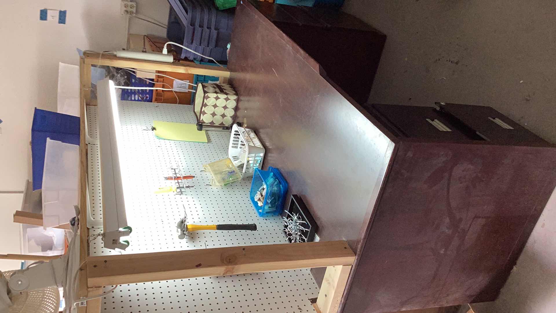 Photo 2 of CRAFT BENCH WITH LIGHT AND FILE CABINET. PEG BOARD INCLUDED.