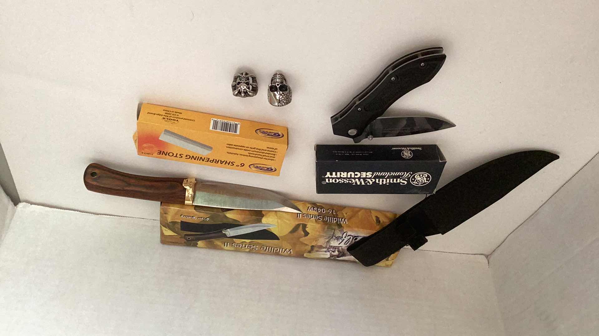 Photo 1 of SMITH AND WESSON HOMELAND SECURITY KNIVES, SHARPENING STONE, AND RINGS