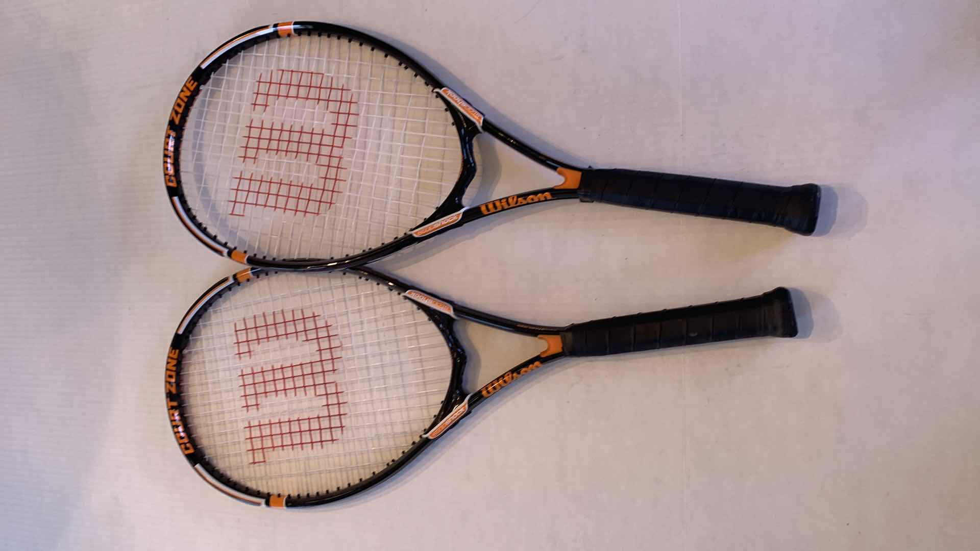 Photo 1 of PAIR OF WILSON COURT ZONE POWERBRIDGE STOP SHOCK TENNIS RAQUETS