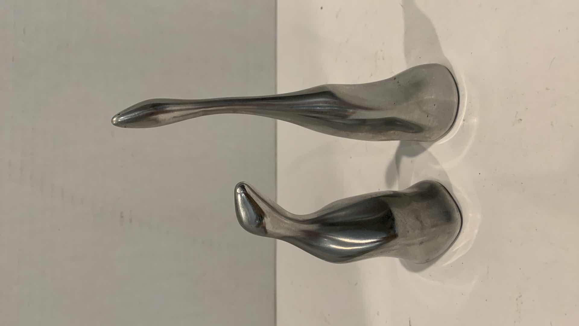 Photo 1 of PAIR OF ALUMINUM SWANS NUMBERED, TALLEST IS 6”