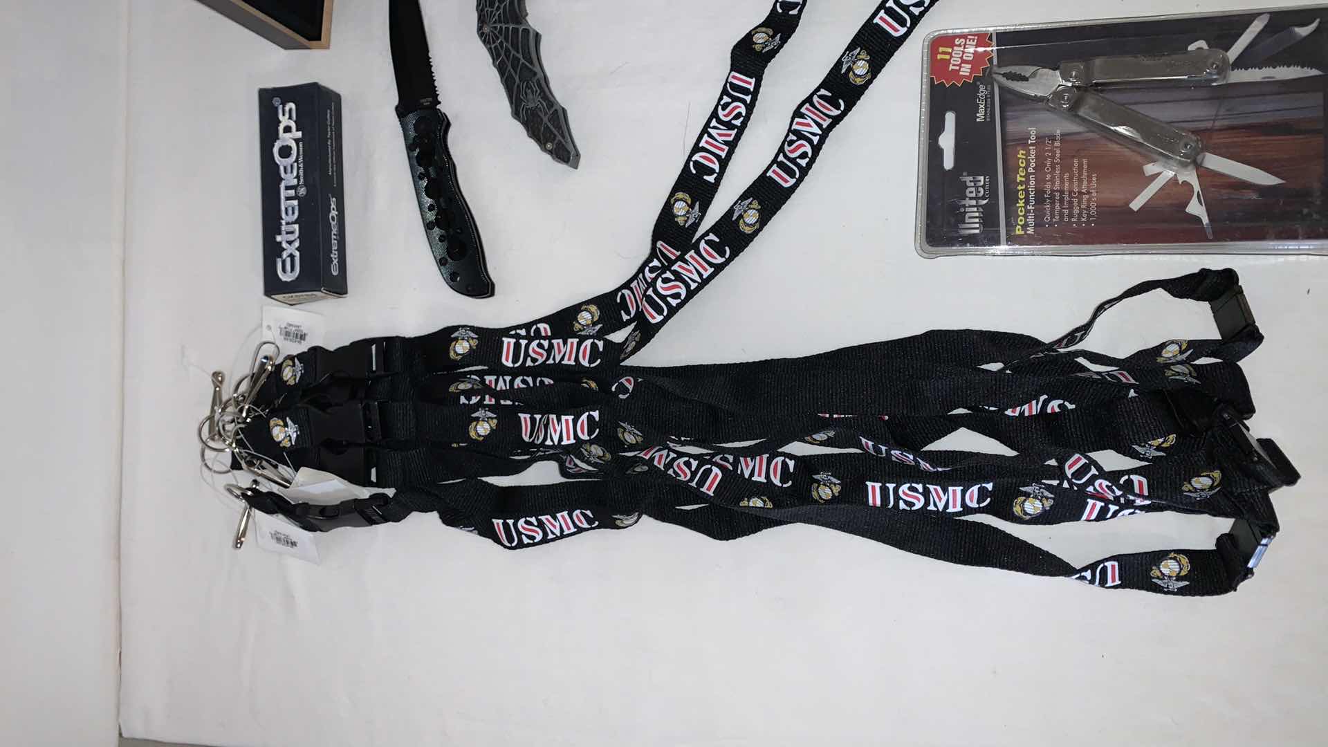 Photo 2 of SET OF USMC LANYARDS WITH SMITH AND WESSON KNIFE, SPIDER-MAN KNIFE, AND POCKET TOOLS