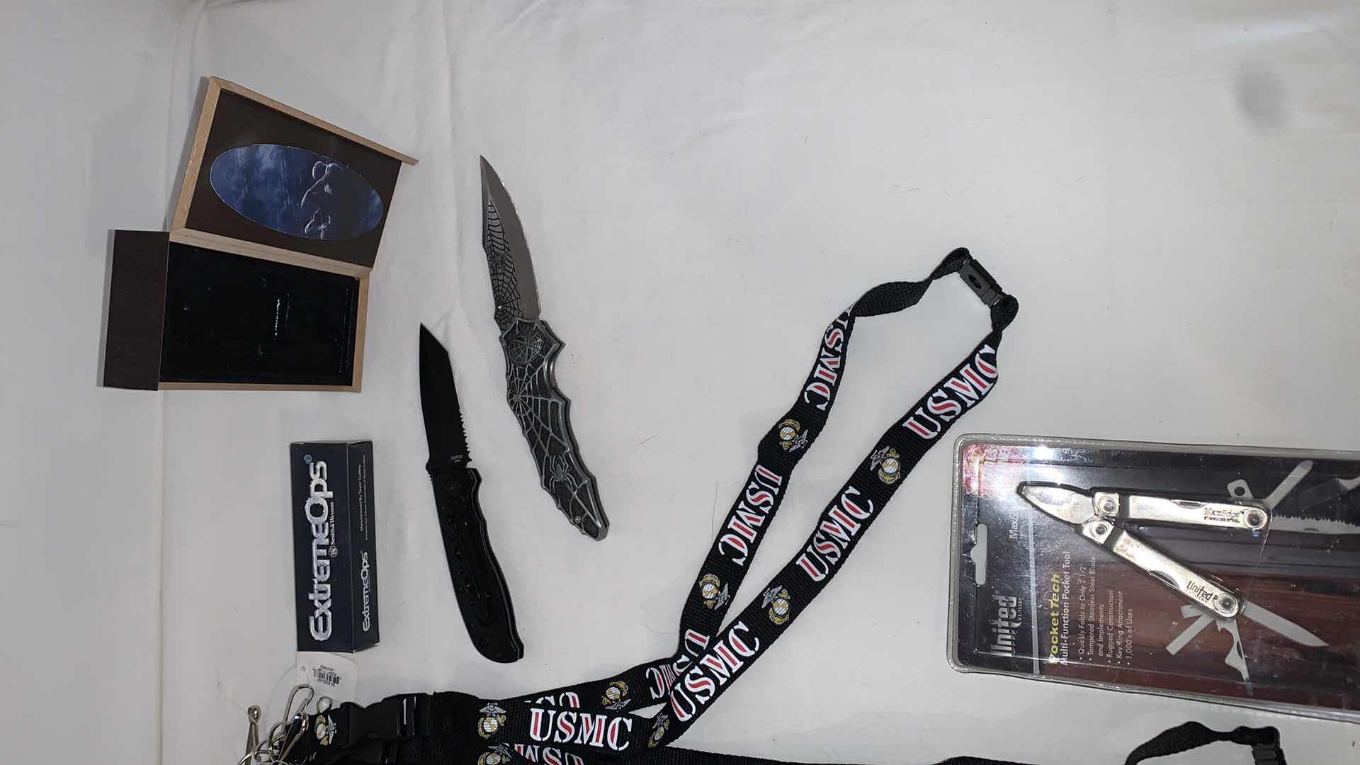 Photo 3 of SET OF USMC LANYARDS WITH SMITH AND WESSON KNIFE, SPIDER-MAN KNIFE, AND POCKET TOOLS