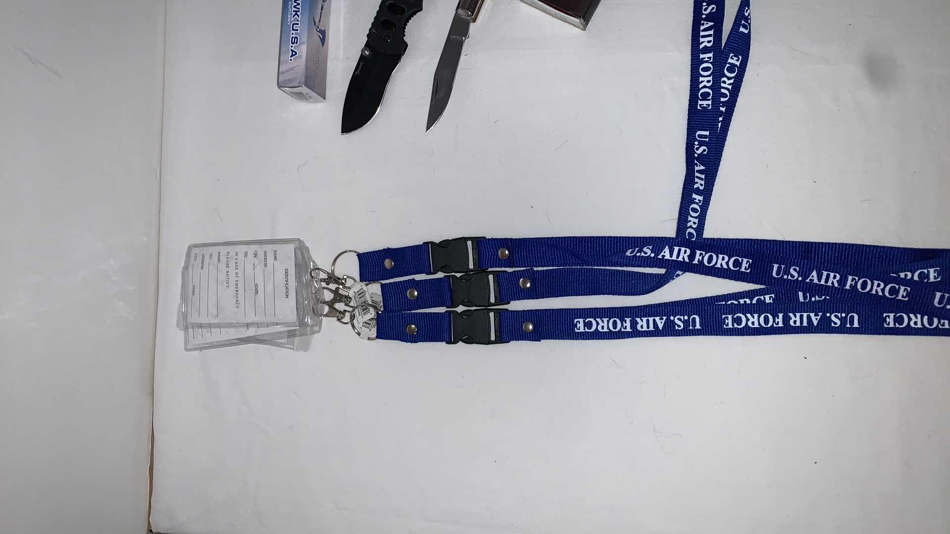 Photo 2 of SET OF U.S. AIR FORCE LANYARDS WITH POCKET TOOLS, TOMAHAWK KNIFE, FOLDING KNIFE, AND CAT EYE MELEE PROTECTION
