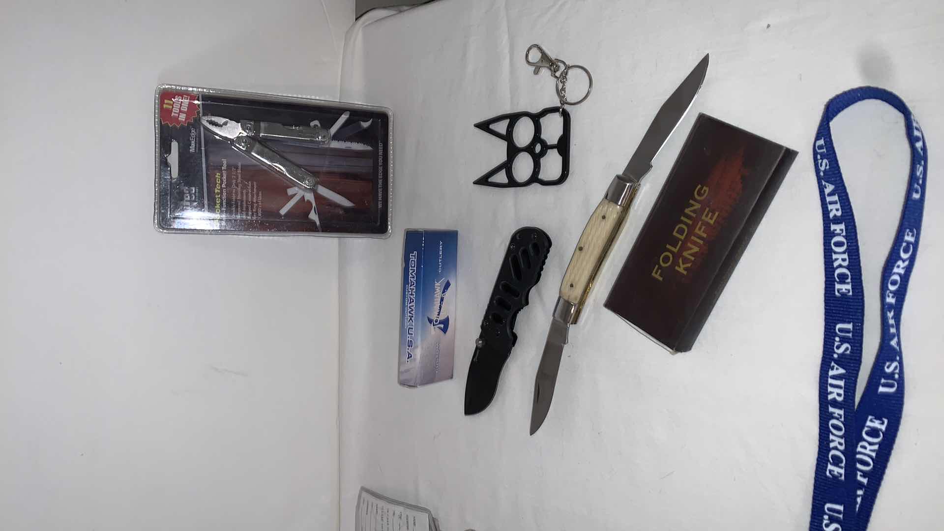Photo 4 of SET OF U.S. AIR FORCE LANYARDS WITH POCKET TOOLS, TOMAHAWK KNIFE, FOLDING KNIFE, AND CAT EYE MELEE PROTECTION