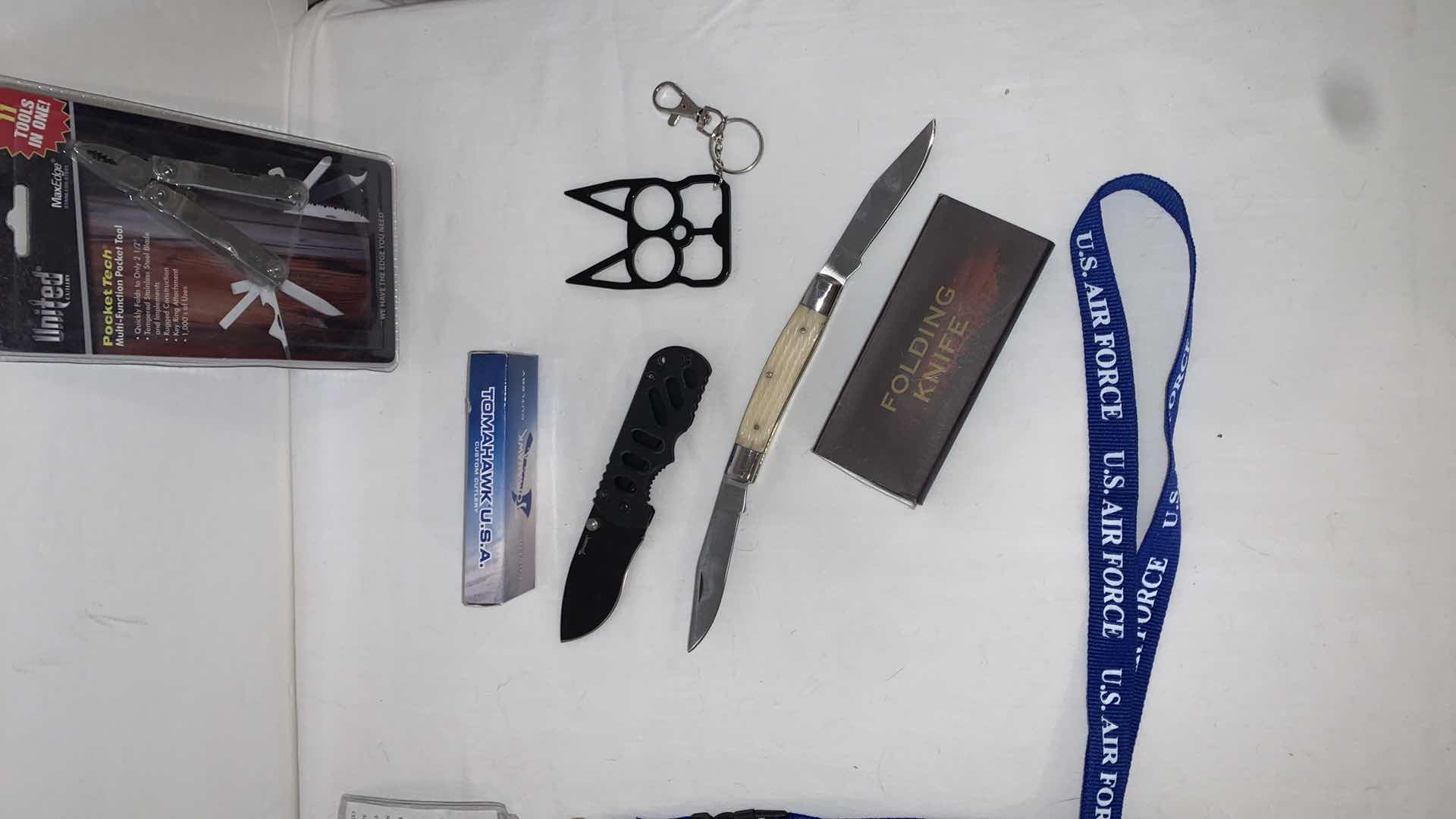 Photo 3 of SET OF U.S. AIR FORCE LANYARDS WITH POCKET TOOLS, TOMAHAWK KNIFE, FOLDING KNIFE, AND CAT EYE MELEE PROTECTION