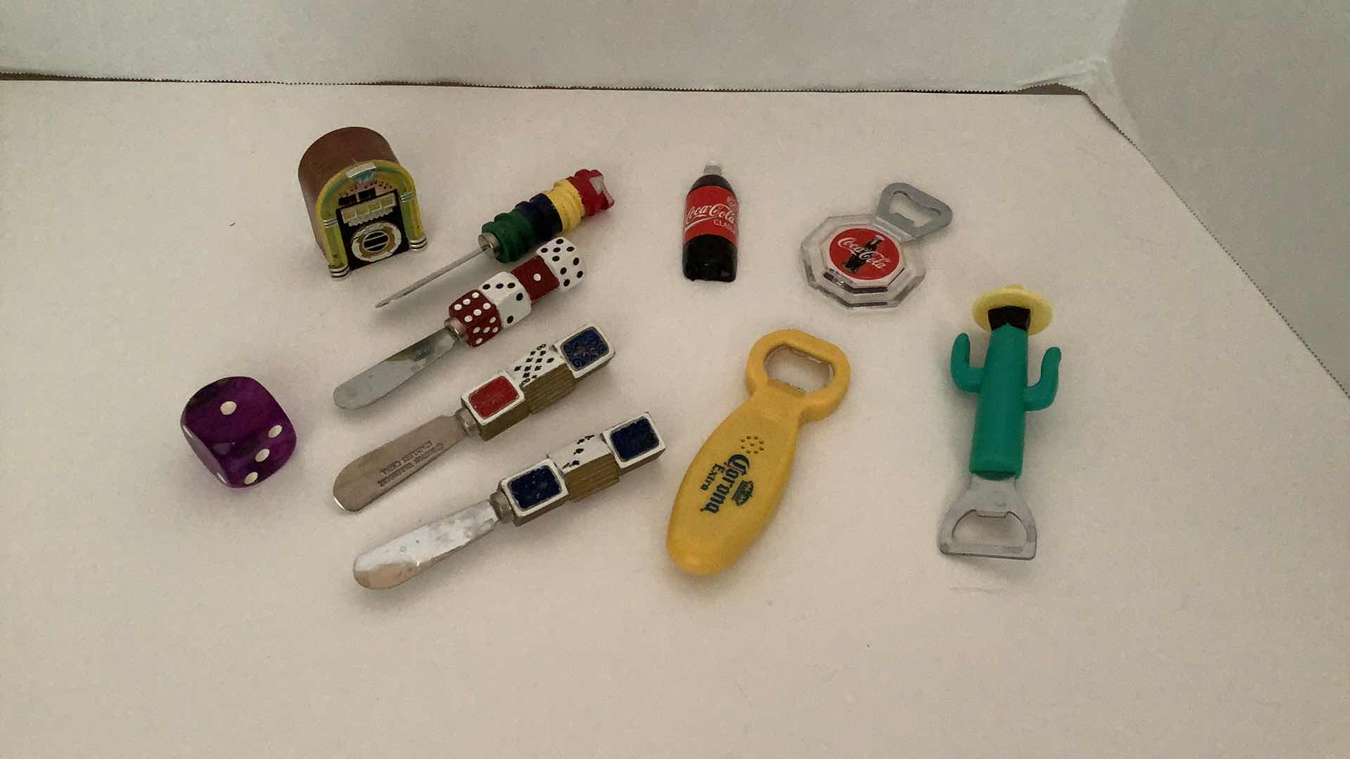 Photo 1 of ASSORTED BOTTLE OPENERS AND BUTTER KNIVES AND MAGNETS