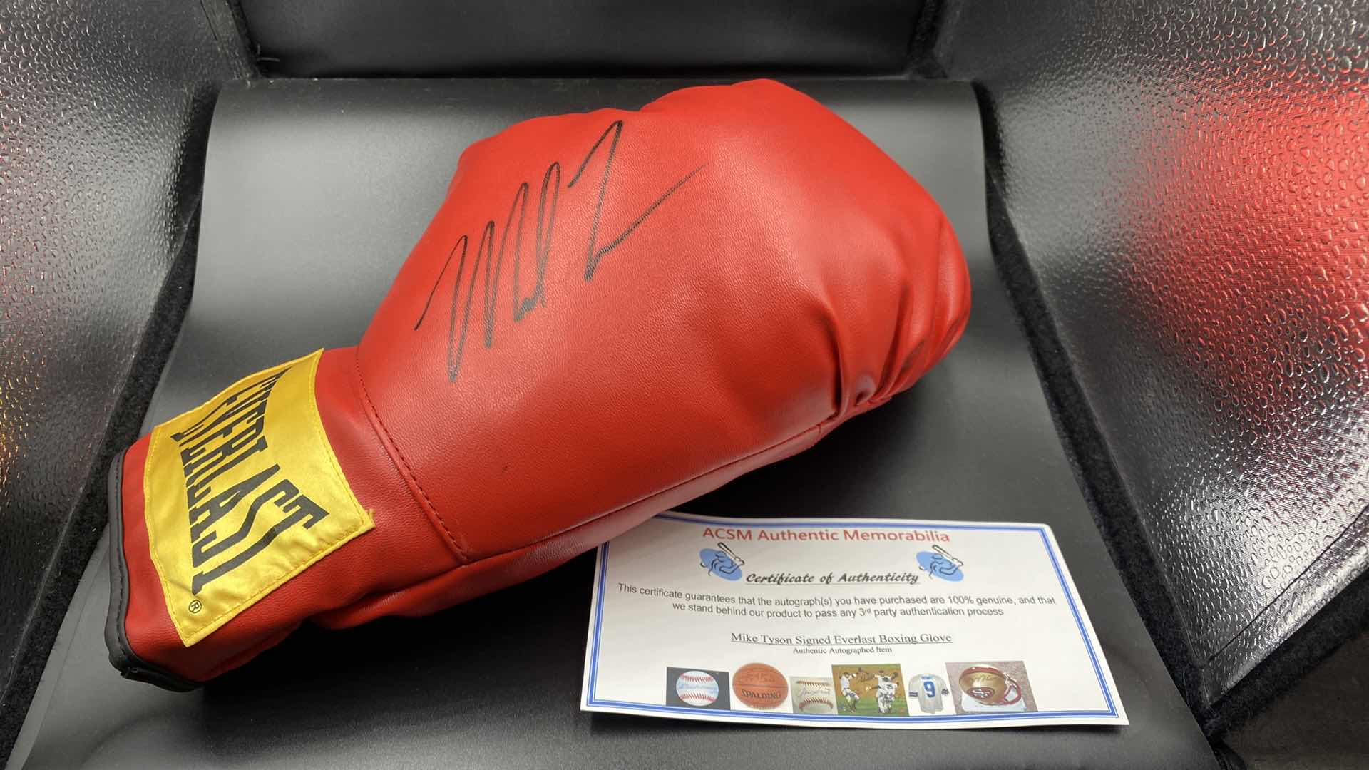 Photo 1 of MIKE TYSON AUTOGRAPHED BOXING GLOVE W COA