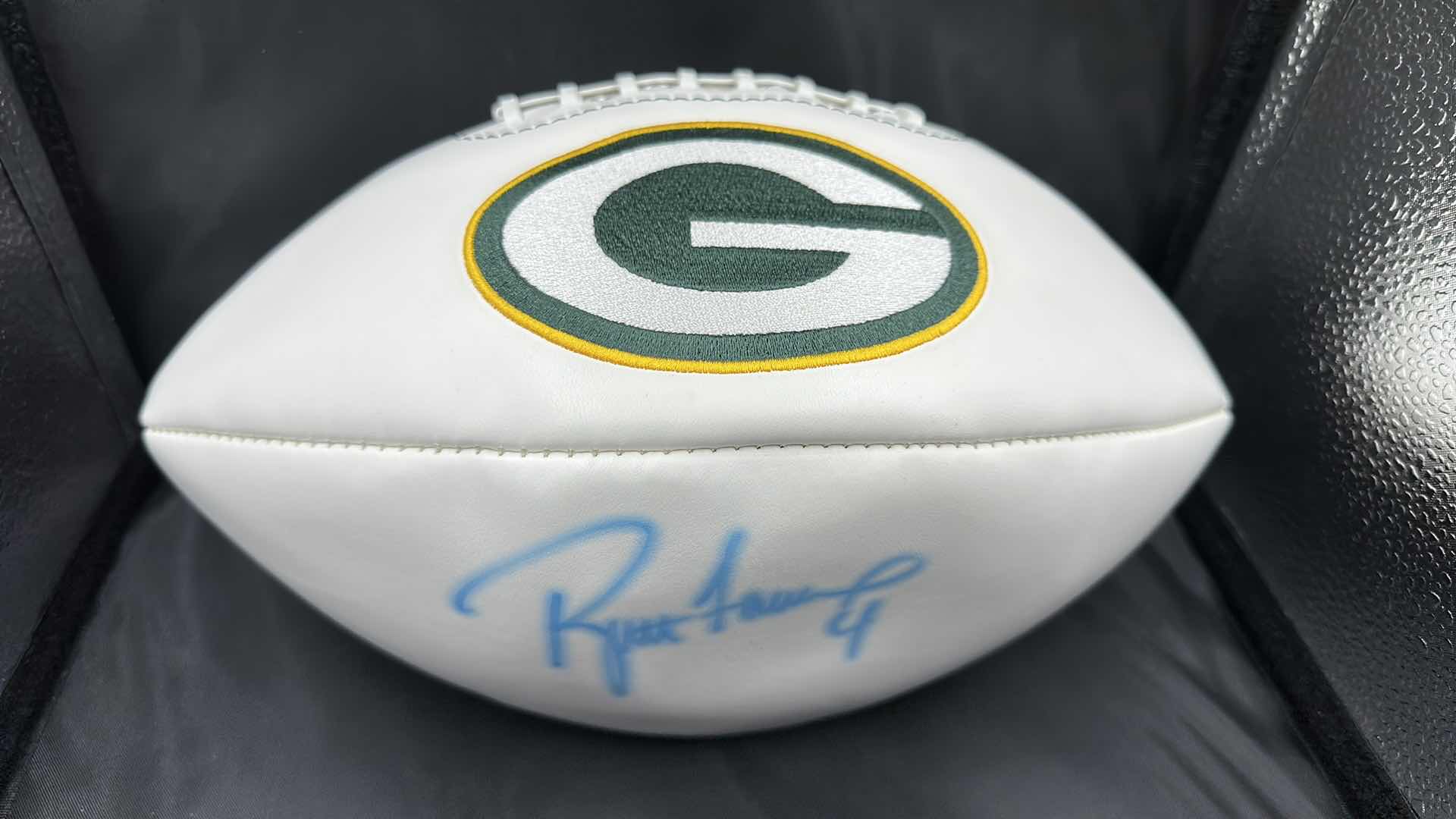 Photo 1 of BRETT FAVRE AUTOGRAPHED PACKERS FOOTBALL AUTHENTICITY VERIFIED BY THE SELLER