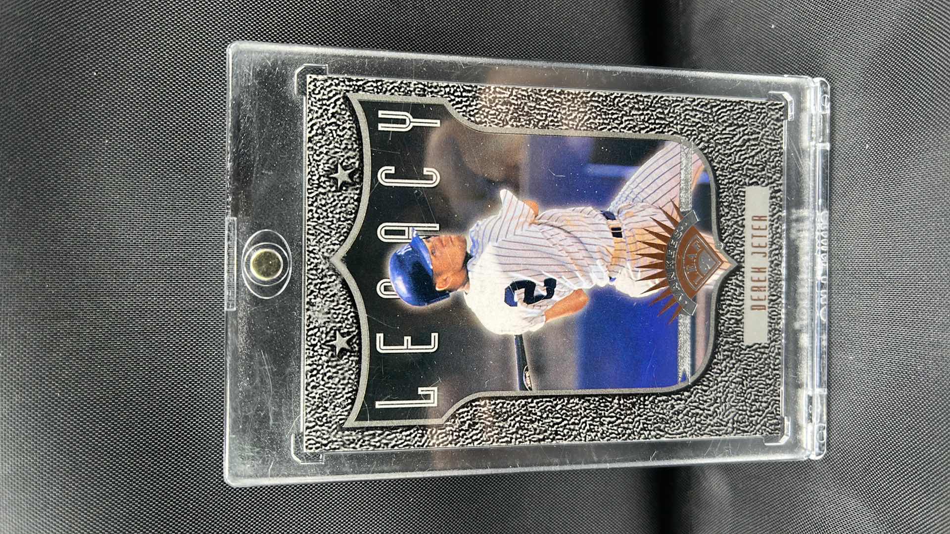 Photo 1 of 1997 leaf Don Russ rookie Derek Jeter