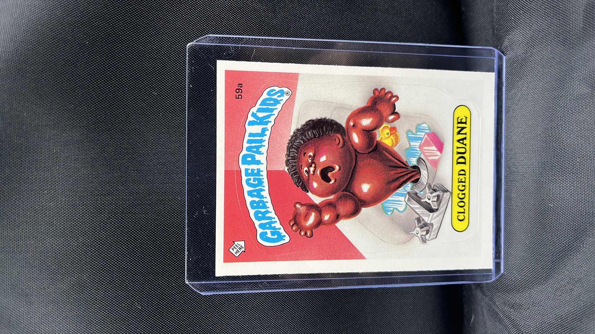 Photo 1 of 1985 Garbage Pail Kids GPK OS1 Series 2 CLOGGED DUANE #59a