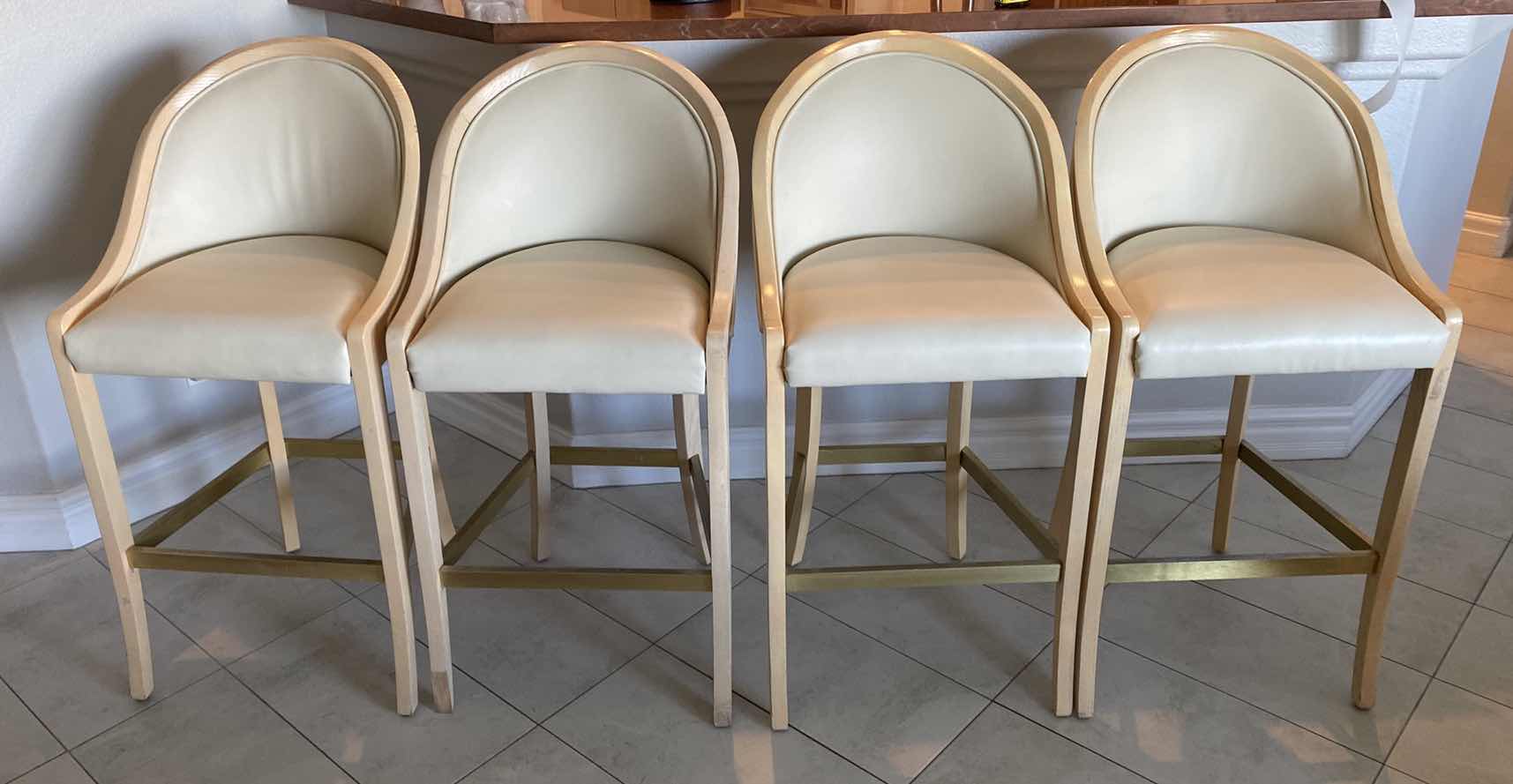 Photo 1 of 4 - CREAM COLOR LEATHER WITH LIGHT WOOD BAR STOOLS FROM THE WYNN - SEAT HEIGHT 31.5”