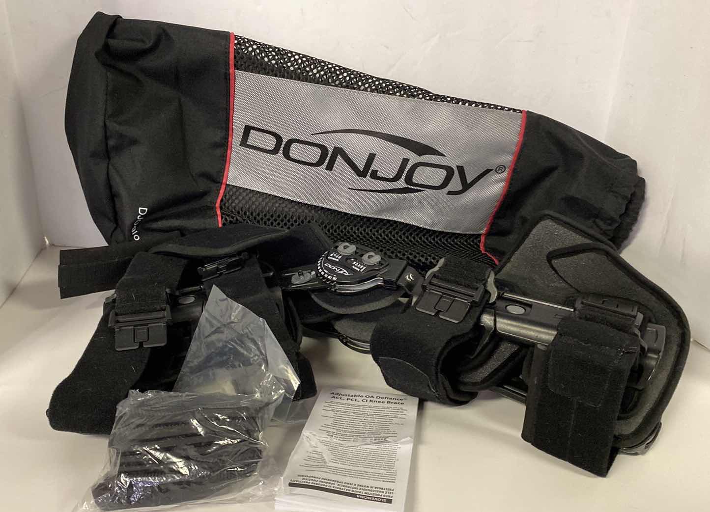 Photo 1 of DONJOY ADJUSTABLE KNEE BRACE WITH ACCESSORIES AND CARRY BAG