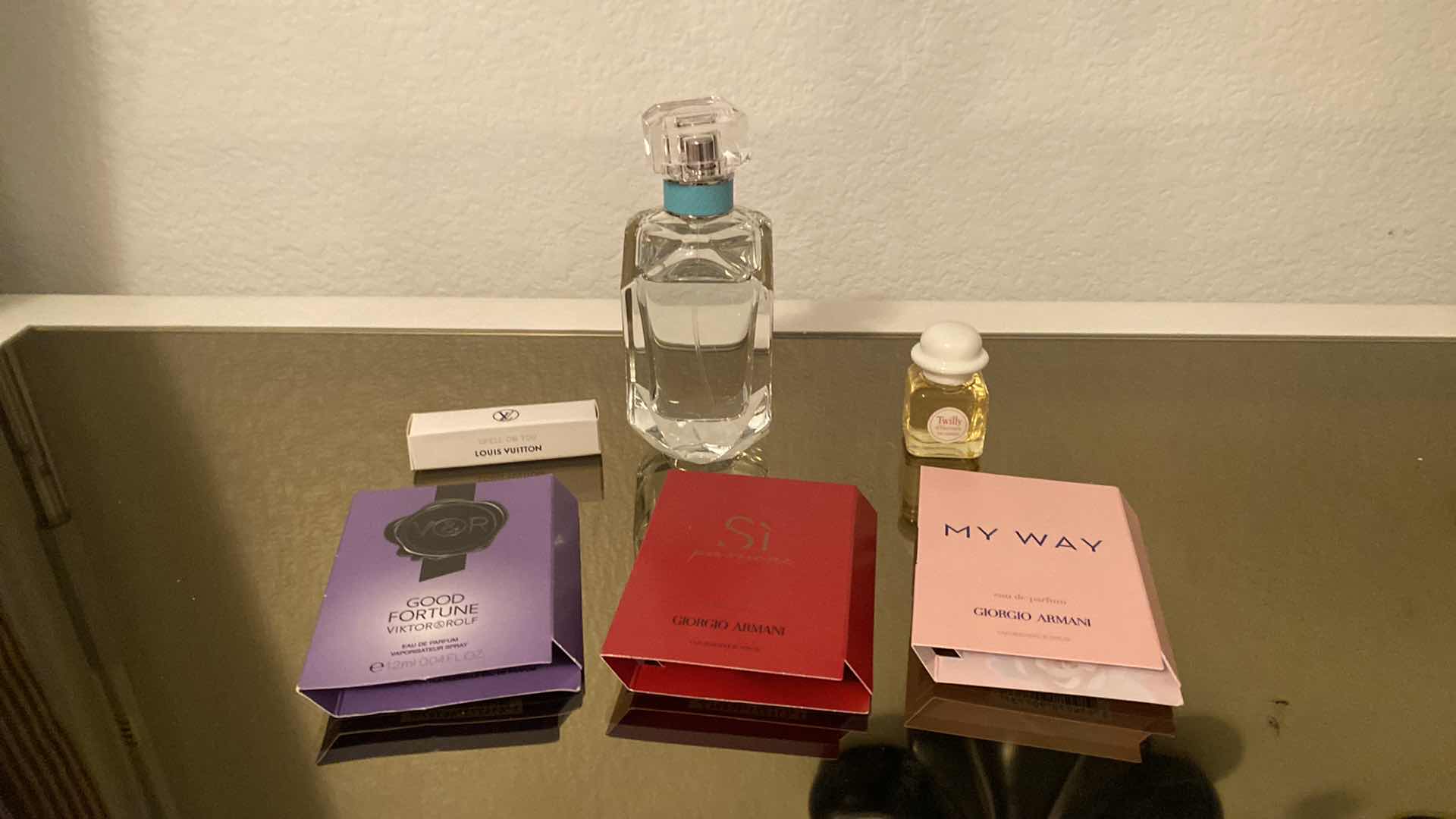 Photo 1 of TIFFANY & CO PERFUME 2.5 FL OZ. 7/8 FULL AND ASSORTED SAMPLES