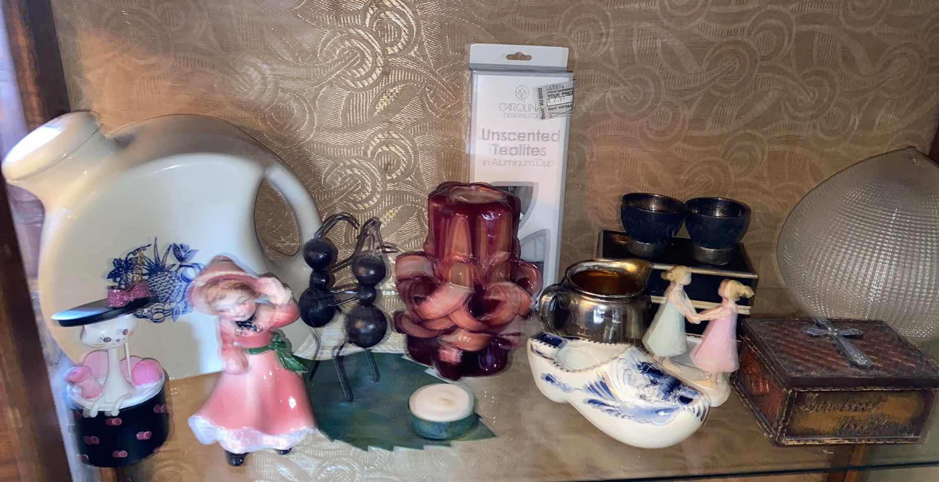 Photo 1 of SHELF OF HOME DECOR IN DINING ROOM