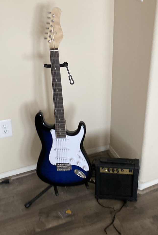 Photo 1 of 6 STRING GUITAR WITH STAND AND AMPLIFIER