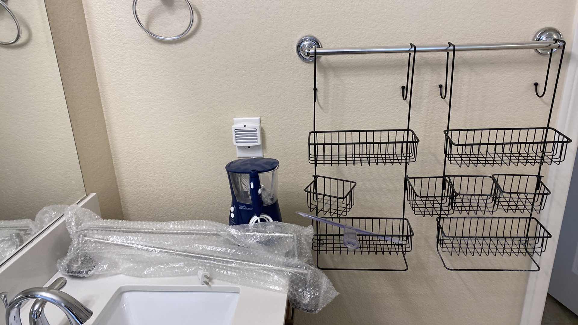 Photo 1 of WIRE HANGING STORAGE WATER PIK SCALE AND TOWEL BAR IN PACKAGES