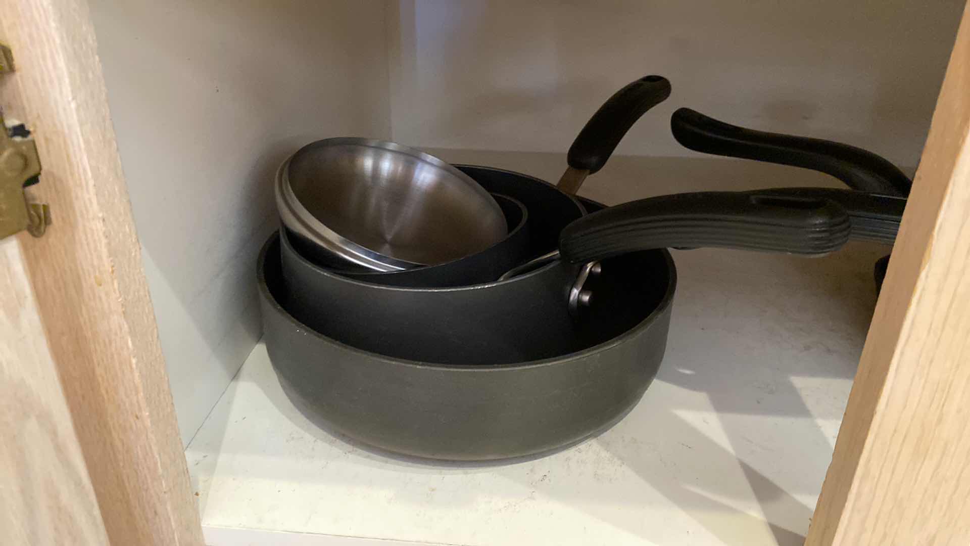 Photo 1 of CONTENTS OF KITCHEN CABINET POTS AND PANS