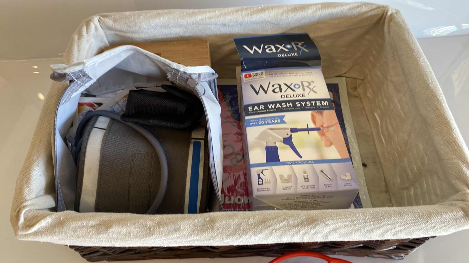 Photo 1 of BASKET WITH BLOOD PRESSURE MONITOR EAR WASH SYSTEM AND MORE
