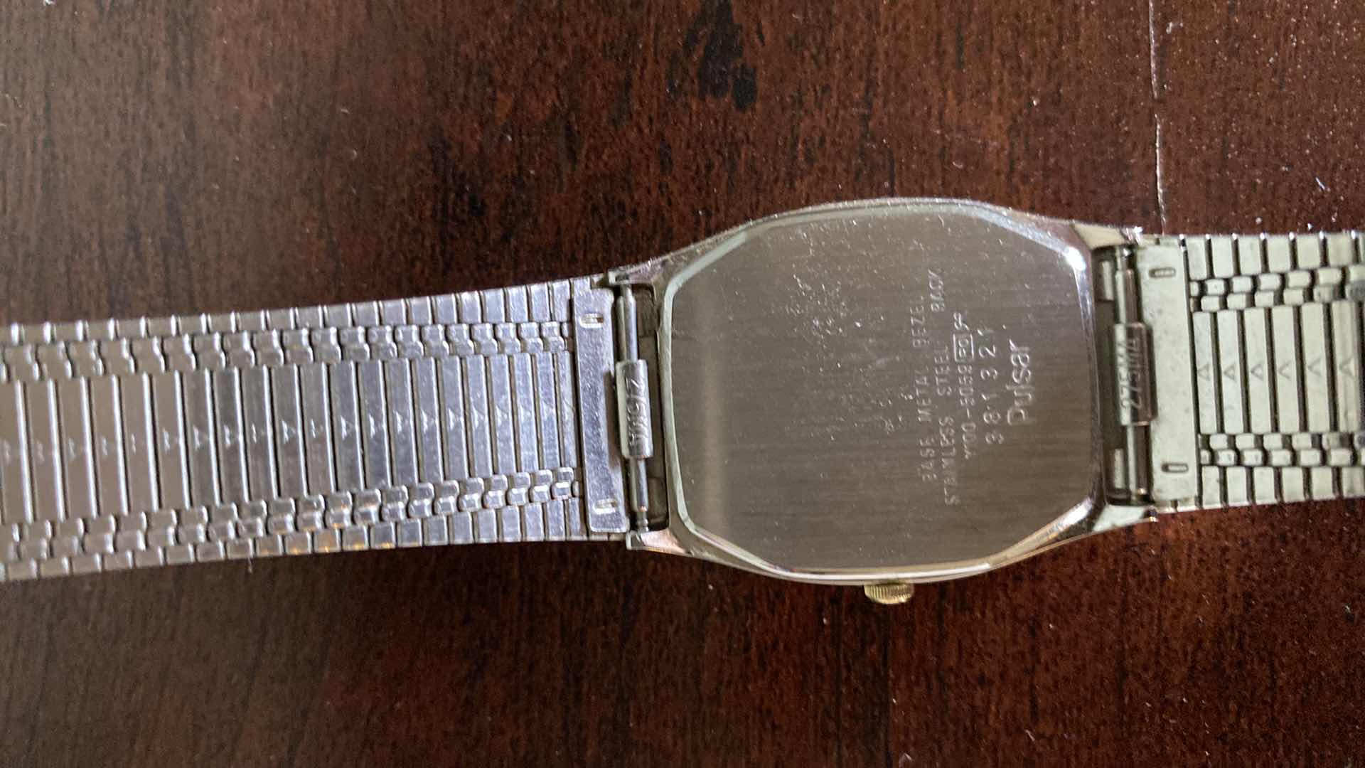 Photo 1 of METAL FEATHER PIN AND PULSAR WATCH