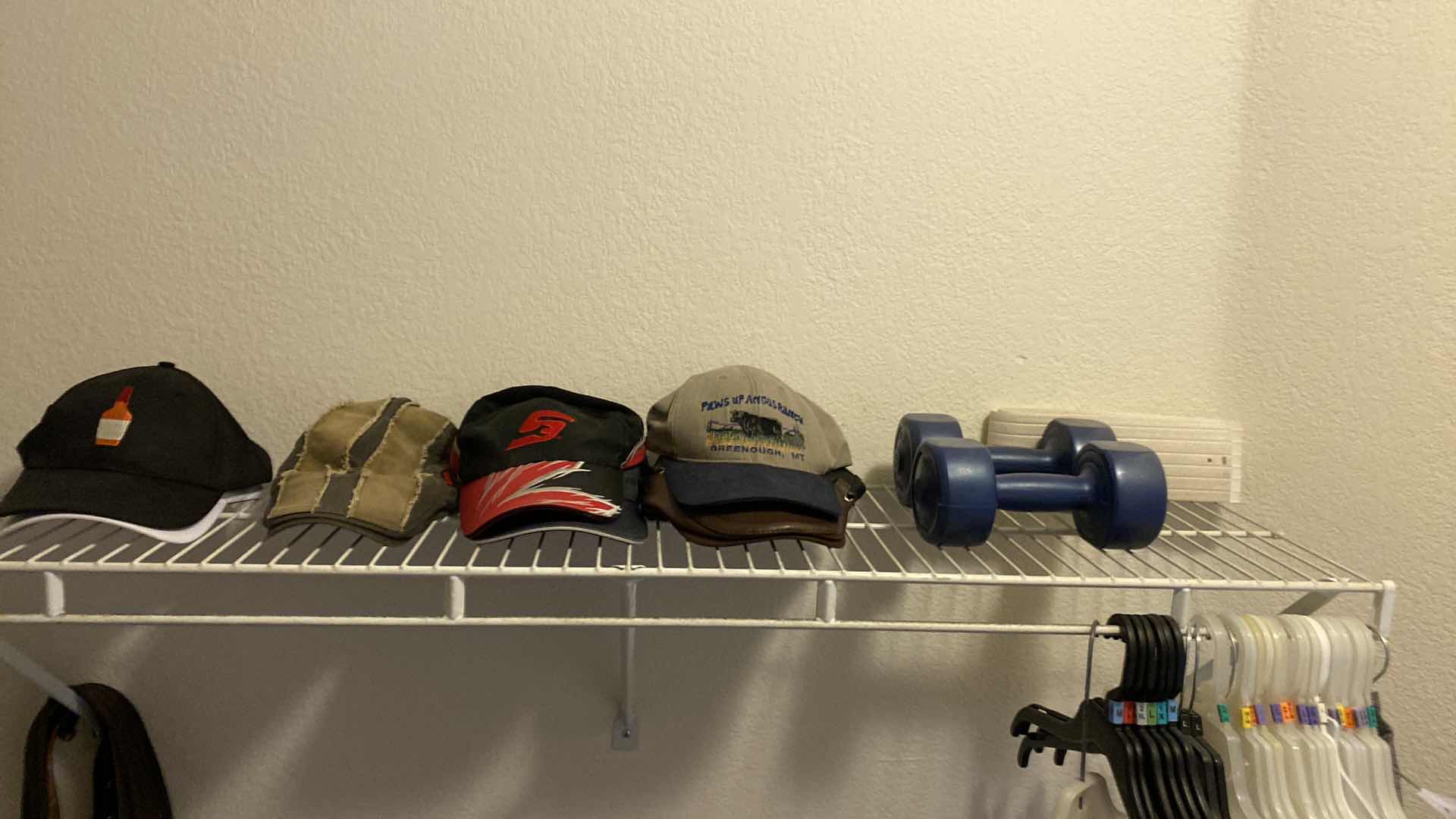 Photo 1 of FREE WEIGHTS AND BASEBALL CAPS AND BELTS BELTS PRIMARY CLOSET