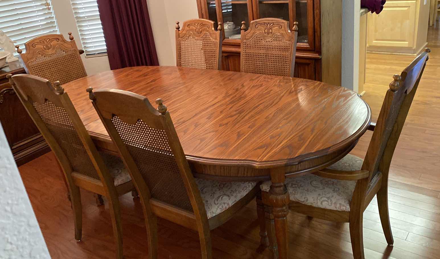 Photo 2 of OAK DINING TABLE WITH 6 CANE BACK CHAIRS MEASUREMENT INCLUDES 18” LEAF 80” x 42” H 30” INCLUDES TABLE PADS