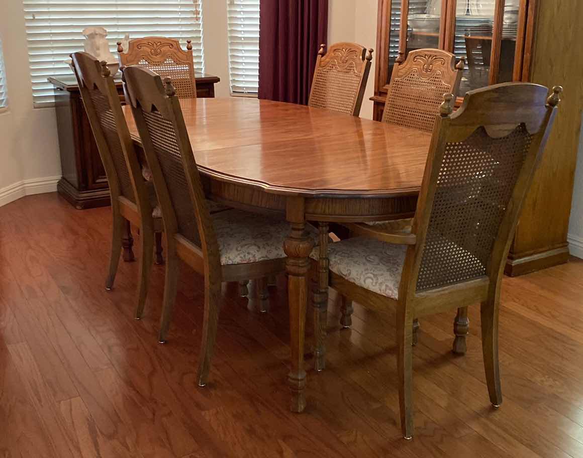 Photo 1 of OAK DINING TABLE WITH 6 CANE BACK CHAIRS MEASUREMENT INCLUDES 18” LEAF 80” x 42” H 30” INCLUDES TABLE PADS