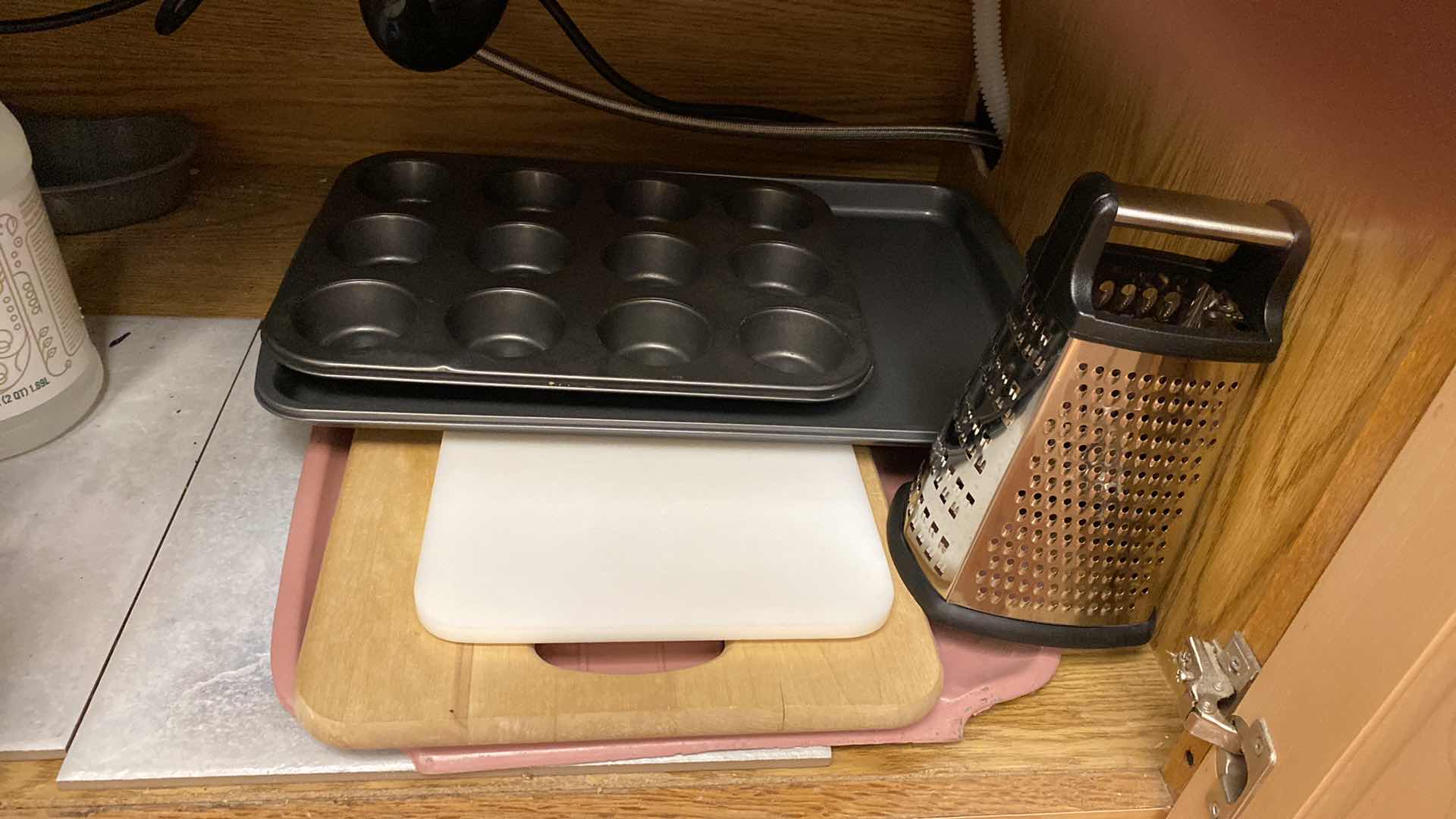 Photo 4 of CONTENTS OF KITCHEN CABINET UNDER SINK CUTTING BOARDS BAKEWARE AND MORE