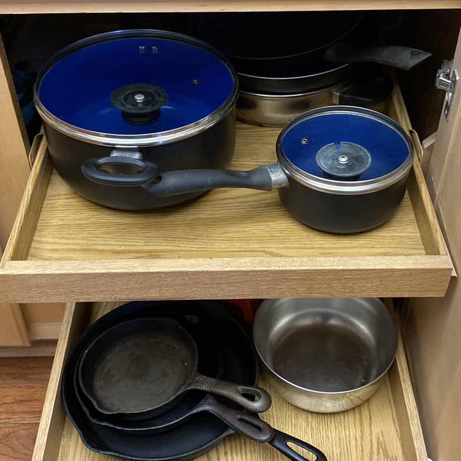 Photo 1 of CONTENTS OF KITCHEN CABINET POTS AND PANS