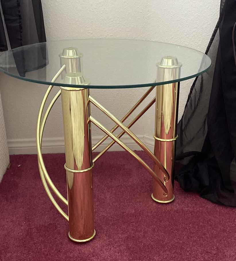 Photo 1 of POLISHED GOLD METAL ROUND TABLE WITH GLASS TOP 25” x 21”