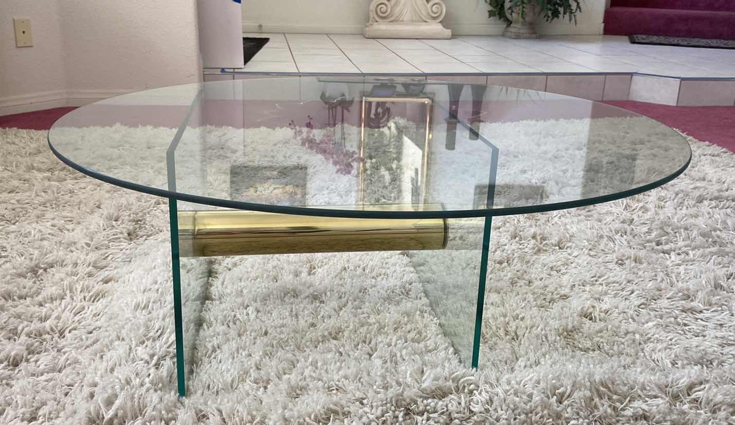 Photo 1 of ROUND POLISHED GOLD METAL WITH GLASS TOP COCKTAIL TABLE 36” x 15”