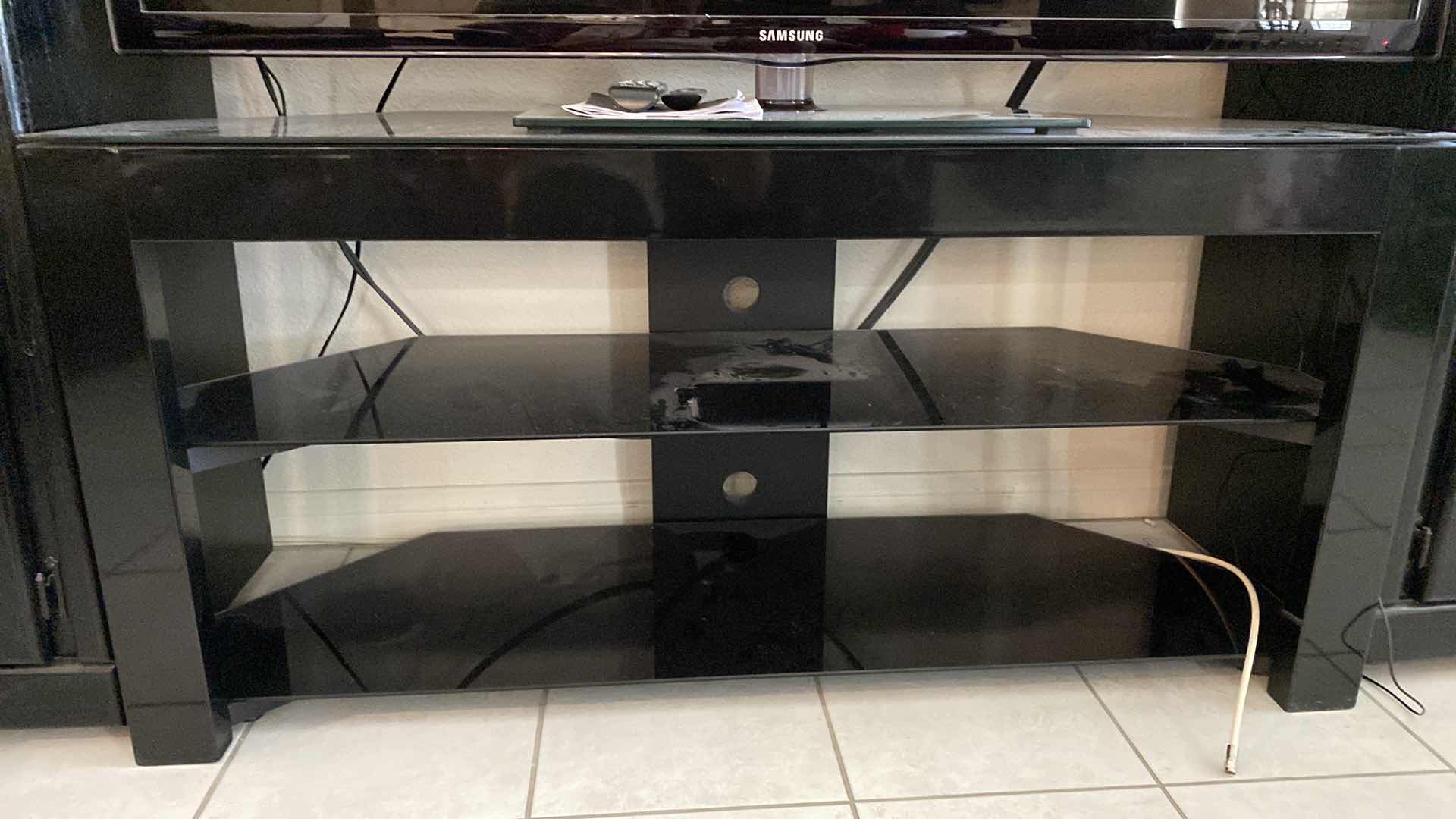 Photo 1 of BLACK GLASS AND METAL TV STAND 50” x 18” H 24” (ALL OTHER ITEMS SOLD SEPARATELY, THIS IS THE STAND ONLY)