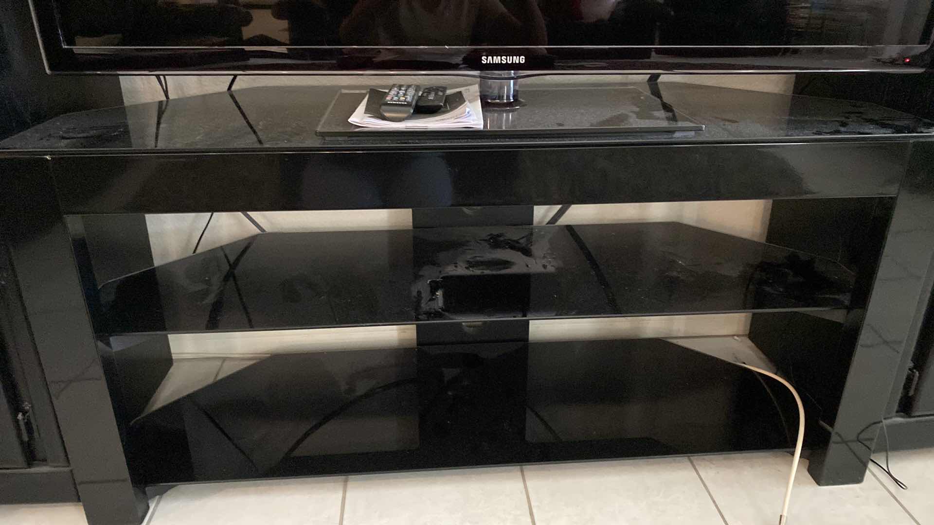 Photo 2 of BLACK GLASS AND METAL TV STAND 50” x 18” H 24” (ALL OTHER ITEMS SOLD SEPARATELY, THIS IS THE STAND ONLY)