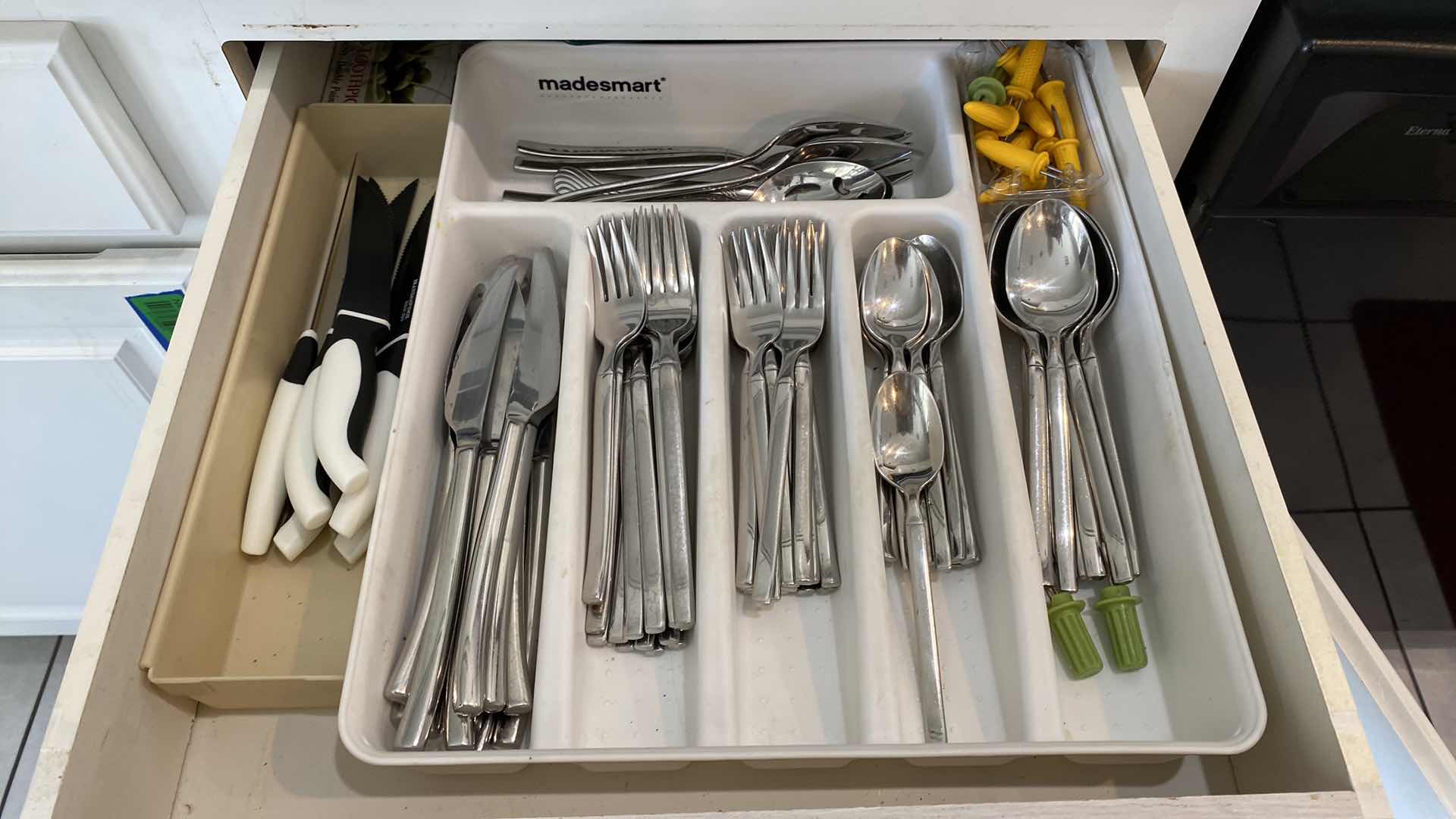 Photo 1 of CONTENTS OF KITCHEN CABINET DRAWER - HENKELS STAINLESS SILVERWARE AND STEAK KNIVES