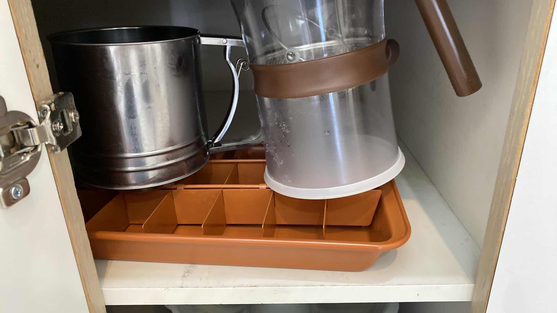 Photo 2 of CONTENTS OF KITCHEN CABINET  BUNDT PANS, BROWNIE PAN