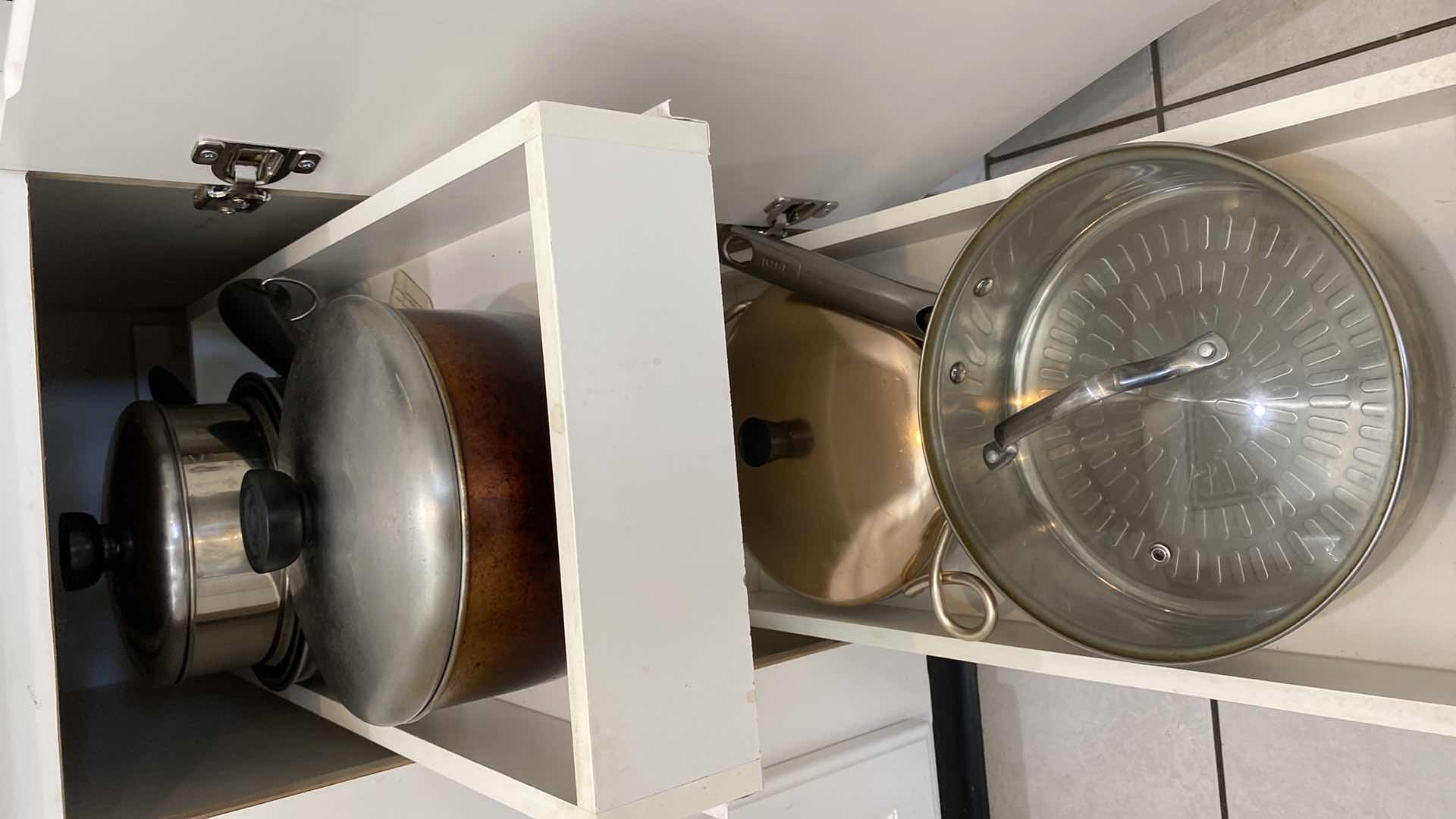 Photo 1 of CONTENTS OF KITCHEN CABINET - PANS WITH LIDS