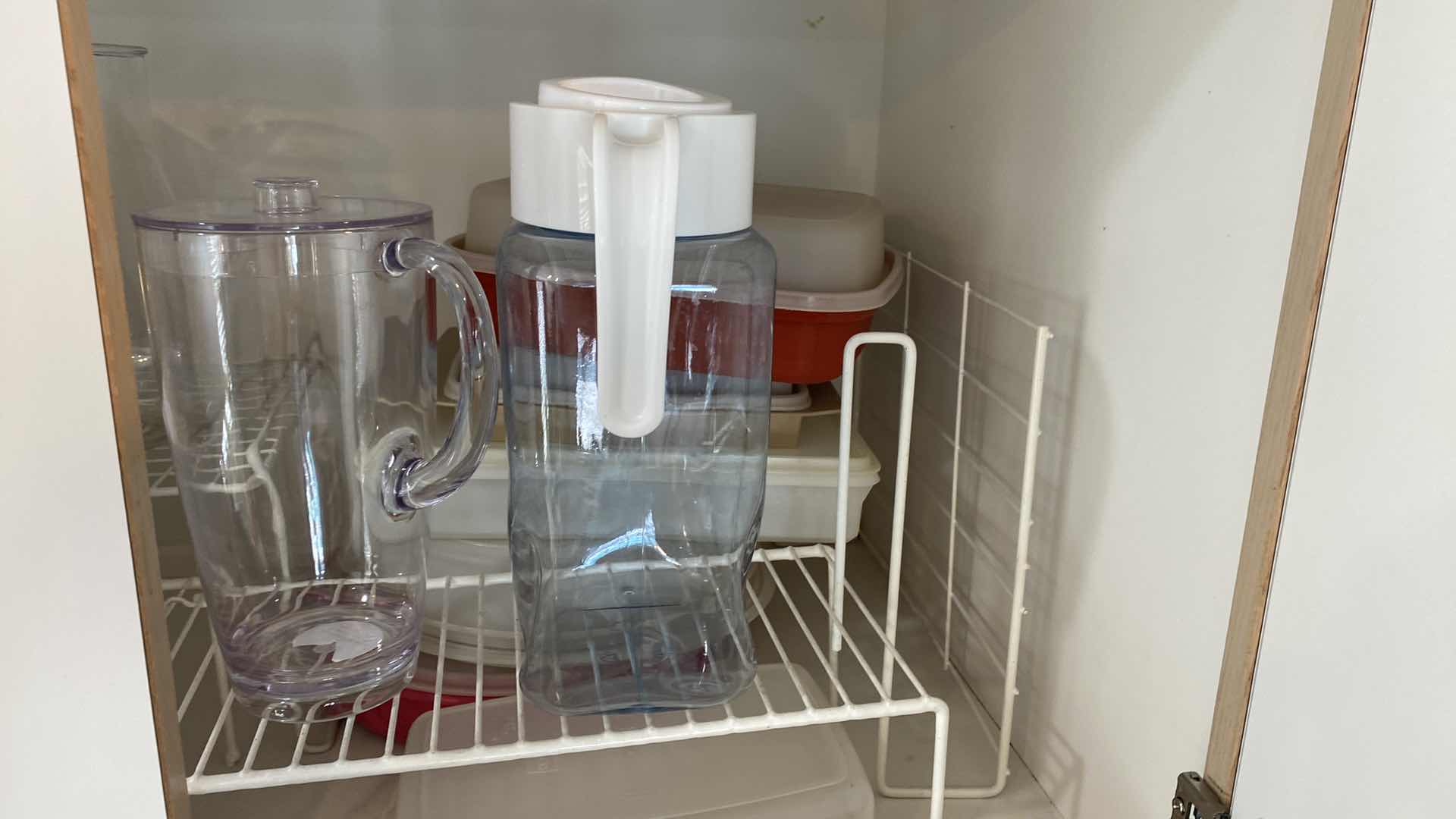 Photo 4 of CONTENTS OF KITCHEN CABINET ABOVE FRIDGE - PLASTIC PITCHERS STORAGE AND SHELVING