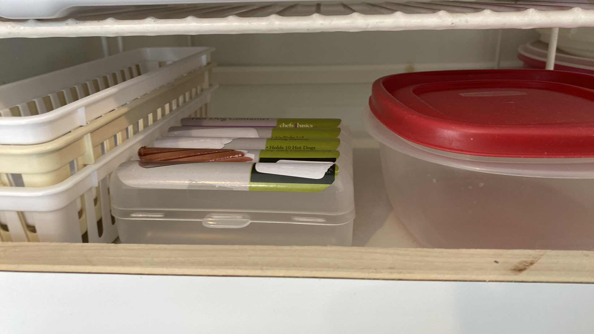 Photo 2 of CONTENTS OF KITCHEN CABINET ABOVE FRIDGE - PLASTIC PITCHERS STORAGE AND SHELVING