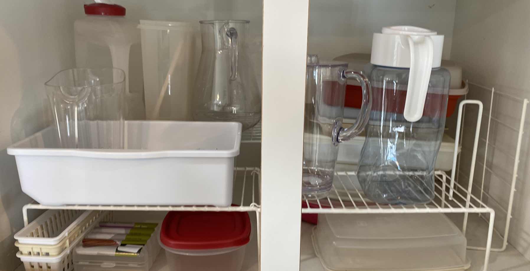 Photo 1 of CONTENTS OF KITCHEN CABINET ABOVE FRIDGE - PLASTIC PITCHERS STORAGE AND SHELVING