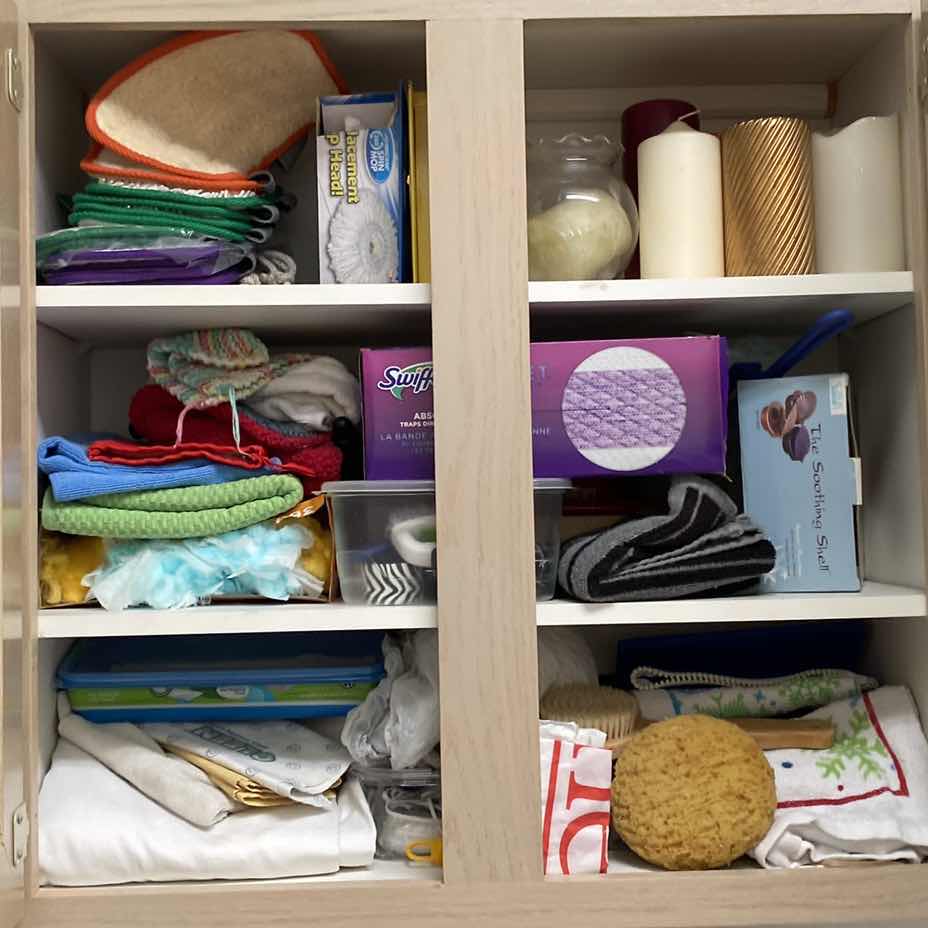 Photo 1 of CONTENTS LAUNDRY ROOM CABINET - CLEANING TOWELS CANDLES