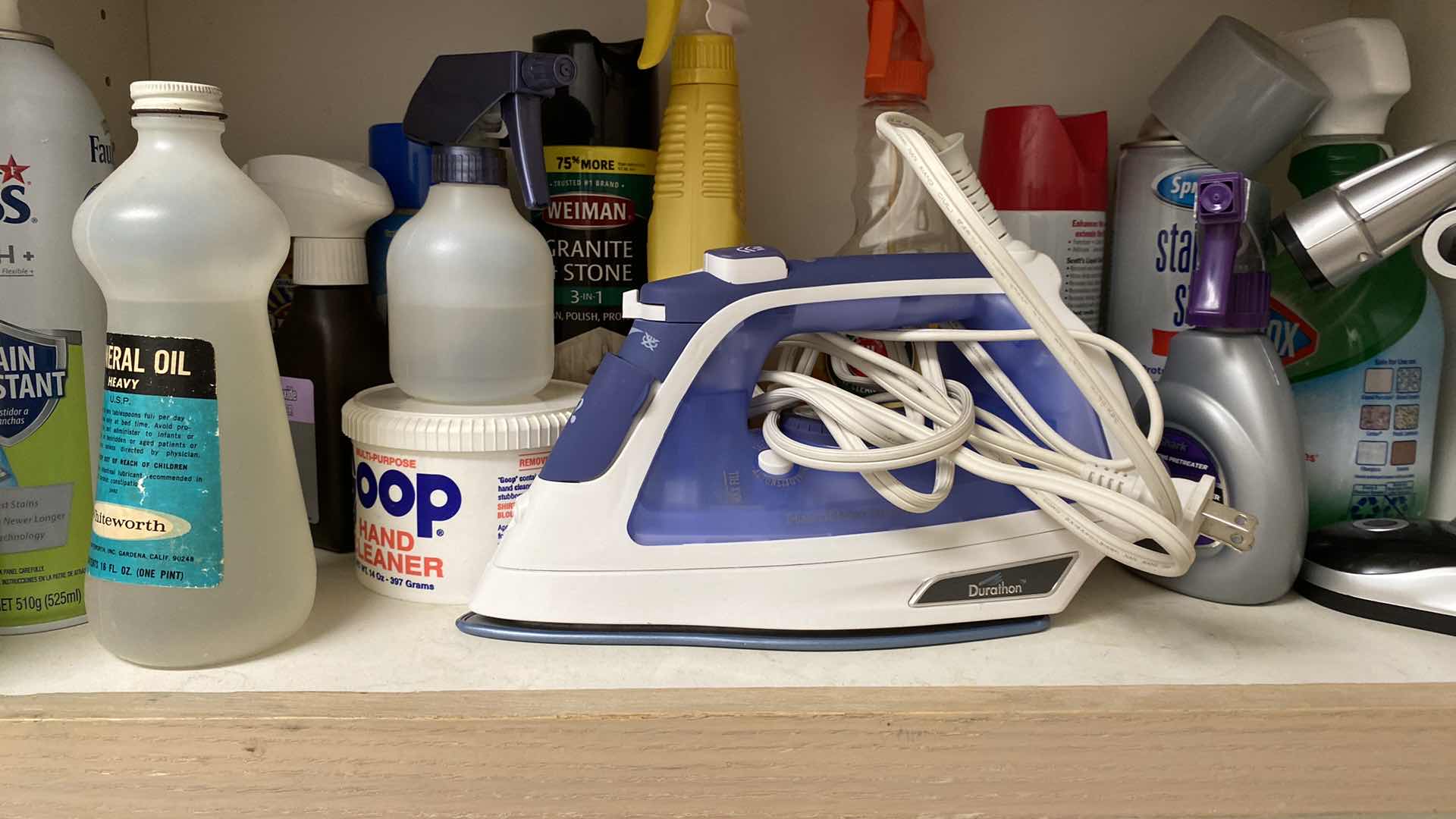 Photo 2 of CONTENTS OF LAUNDRY ROOM CABINET IRON TAPE AND MORE