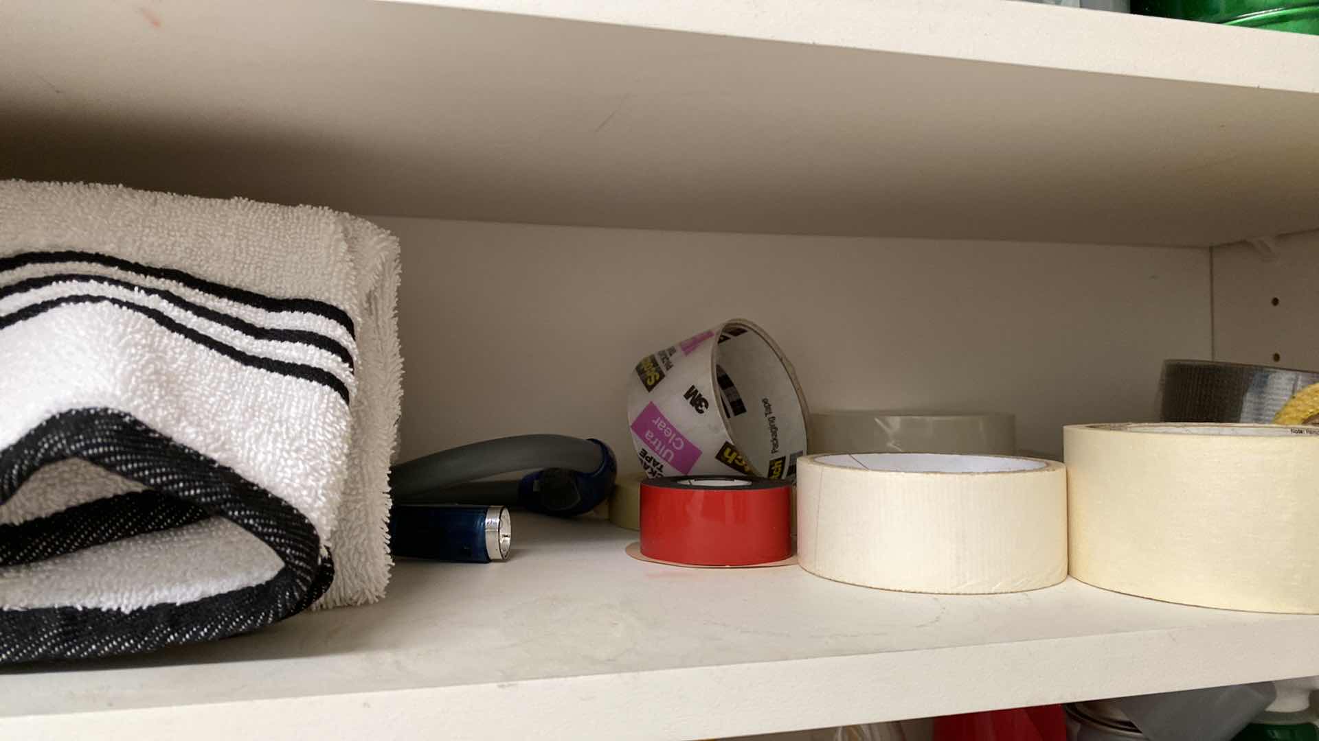 Photo 3 of CONTENTS OF LAUNDRY ROOM CABINET IRON TAPE AND MORE