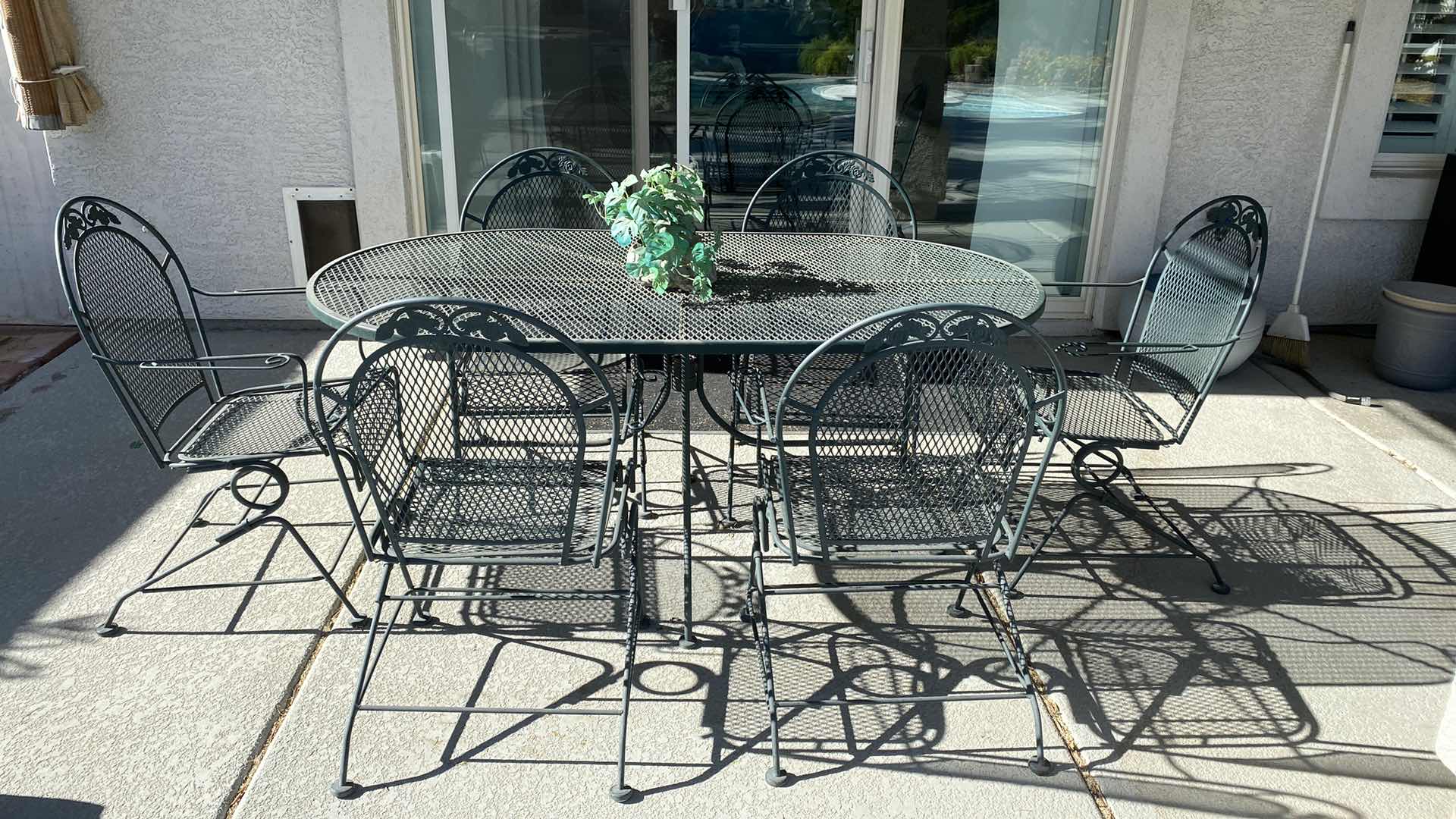 Photo 1 of GREEN IRON MESH PATIO TABLE WITH 6 CHAIRS. 66“ x 38“ H 29 1/2”