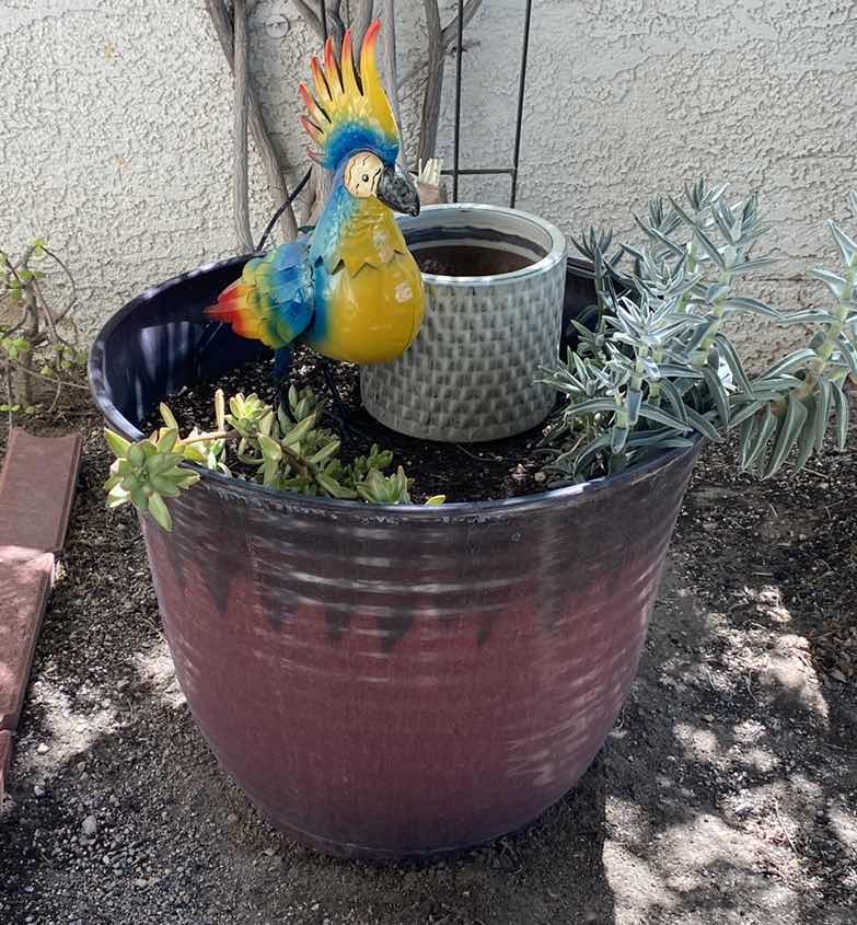 Photo 1 of RESIN PLANTER WITH PLANTS AND METAL BIRD, POT MEASURES 20” x 17 1/2”