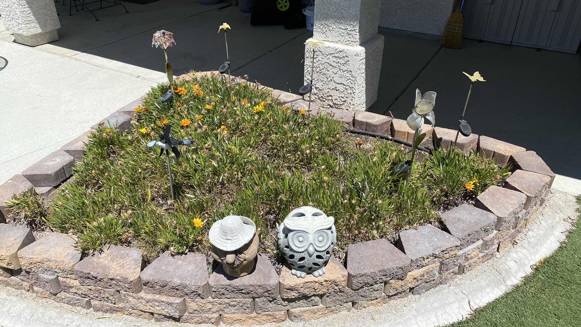 Photo 1 of OWL AND POTTERY FACE PLUS SOLAR LIGHTS IN THE PLANTER