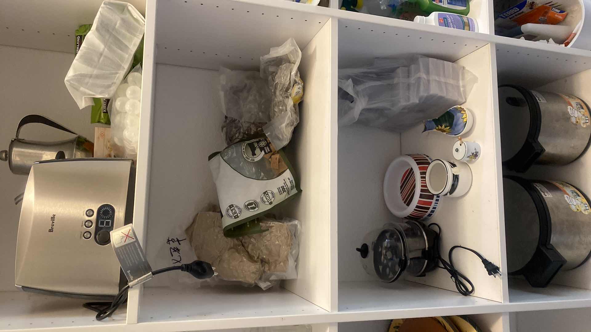 Photo 1 of ONE SECTION OF WALK IN PANTRY - PANS, DOG AND ASIAN FOOD ITEMS